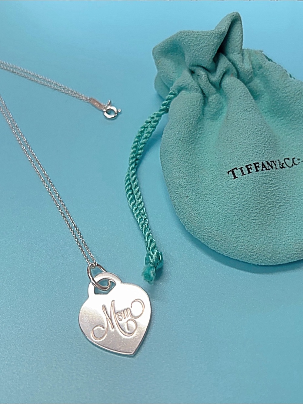 Tiffany & Co. Sterling Silver Heart 'Mom' Pendant Necklace with Blue-Green Pouch